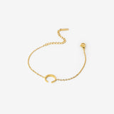 18k gold plated stainless steel minimal crescent bracelet by Salaam Gallery, elegant and affordable jewelry