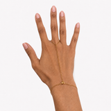 Amira Heart Gold Hand Chain worn on hand with a delicate bracelet-to-ring chain design