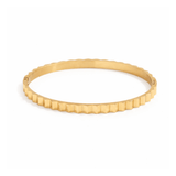 Axis gold faceted bangle in 18K gold plated stainless steel on white background