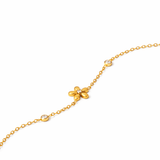 Close up of Bloom gold flower bracelet with crystal accents and delicate chain