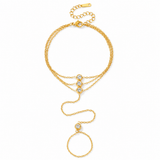 Crystal Cascade Gold Hand Chain with layered gold chains and round crystal accents on a white background