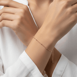 Dainty Dotted Bracelet worn on wrist featuring delicate spaced gold beads and adjustable extension chain