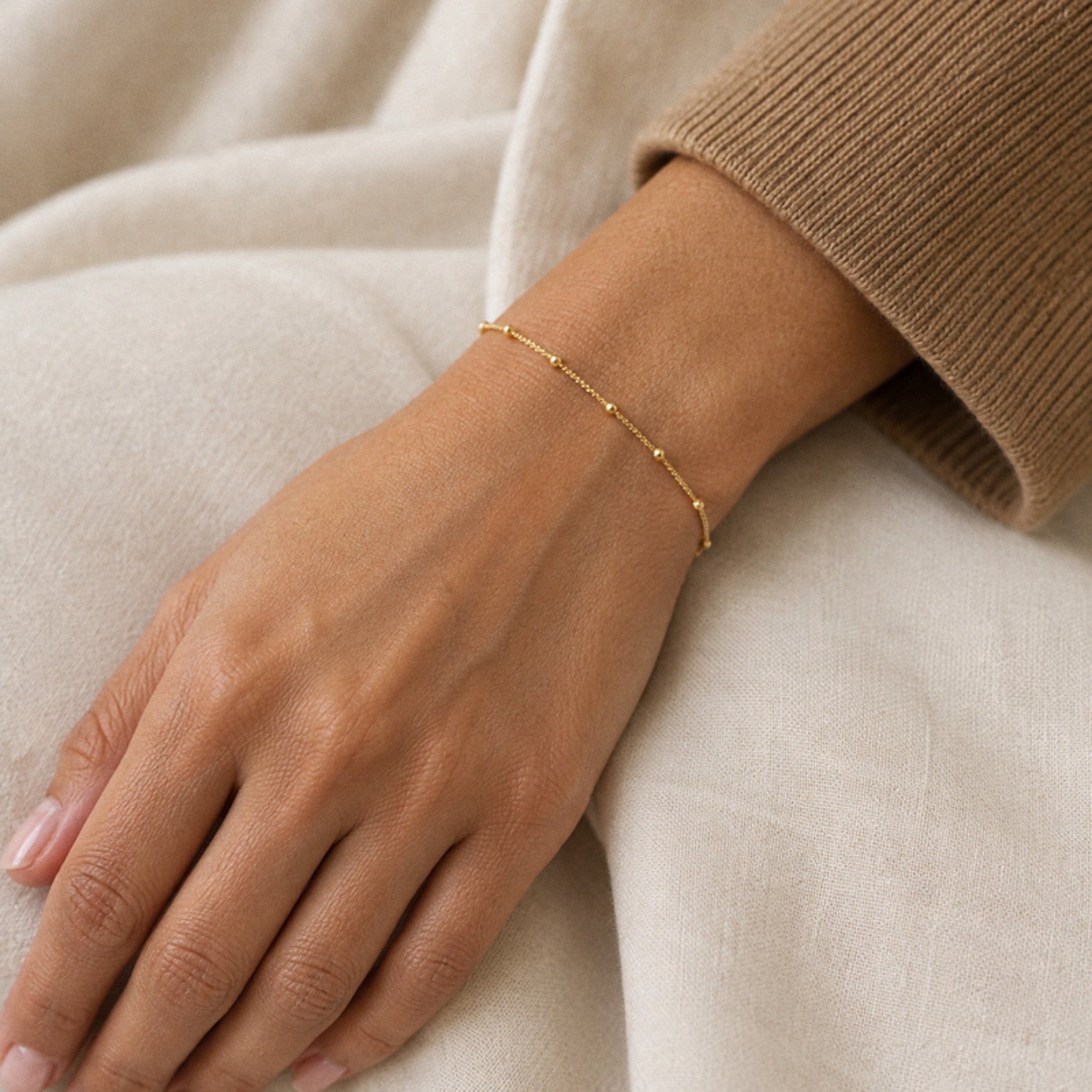 Dainty Satellite Anklet – 18K gold plated stainless steel, styled lifestyle shot