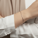 Dainty Wire Bracelet worn on wrist featuring slim 18K gold plated stainless steel chain with minimalist design