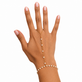 Eterna Pearl Gold Hand Chain worn on hand with pearl details and a graceful bracelet-ring silhouette