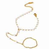 Eterna Pearl Gold Hand Chain with pearl accents and a delicate bracelet-to-ring design on a white background