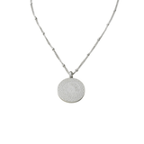 Silver Guide Us to the Straight Path Necklace featuring Arabic Quran verse “Guide us to the straight path” engraved on a circular pendant, photographed on a white background.