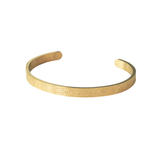 Gold Hidden Reminder Cuff featuring subtle engraved Sabr, Shukr, and Tawakkul, designed as a discreet Islamic reminder bracelet.