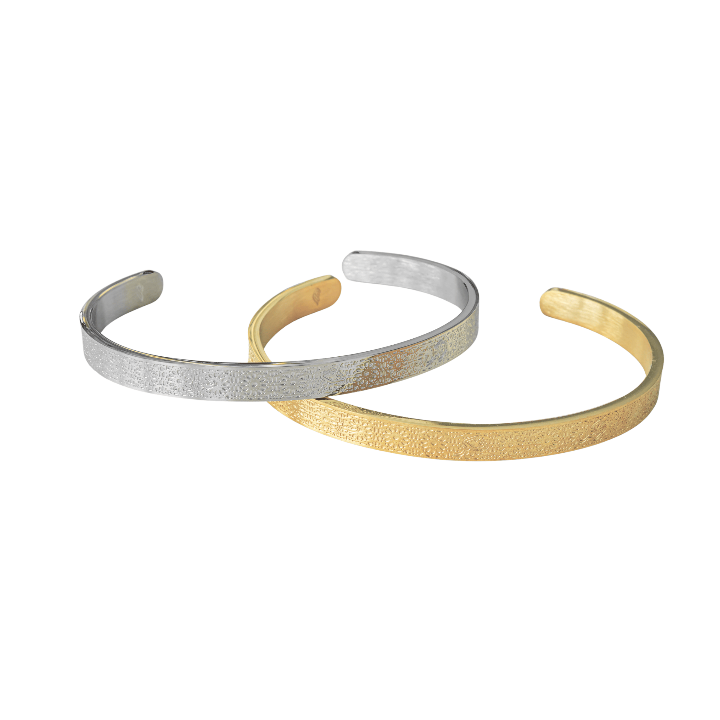 Gold and silver Hidden Reminder Cuffs displayed together, featuring discreet Sabr, Shukr, and Tawakkul engraving.
