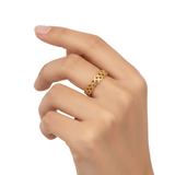 Model wearing Woven Love Ring gold infinity heart band dainty interwoven heart design