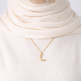 Qamar Crescent Pendant silver crescent moon necklace worn with cream hijab