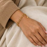 Qufl Link Bracelet – 18K gold plated stainless steel, styled lifestyle shot