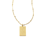 Remember Me Necklace in gold featuring Arabic Quran verse “Fadhkurūnī adhkurkum” engraved on a rectangular pillar pendant, displayed on a clean white background.