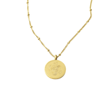 Sabr, Shukr & Tawakkul Coin Necklace in gold featuring Arabic words for patience, gratitude, and trust in Allah engraved on a circular coin pendant, displayed on a white background.