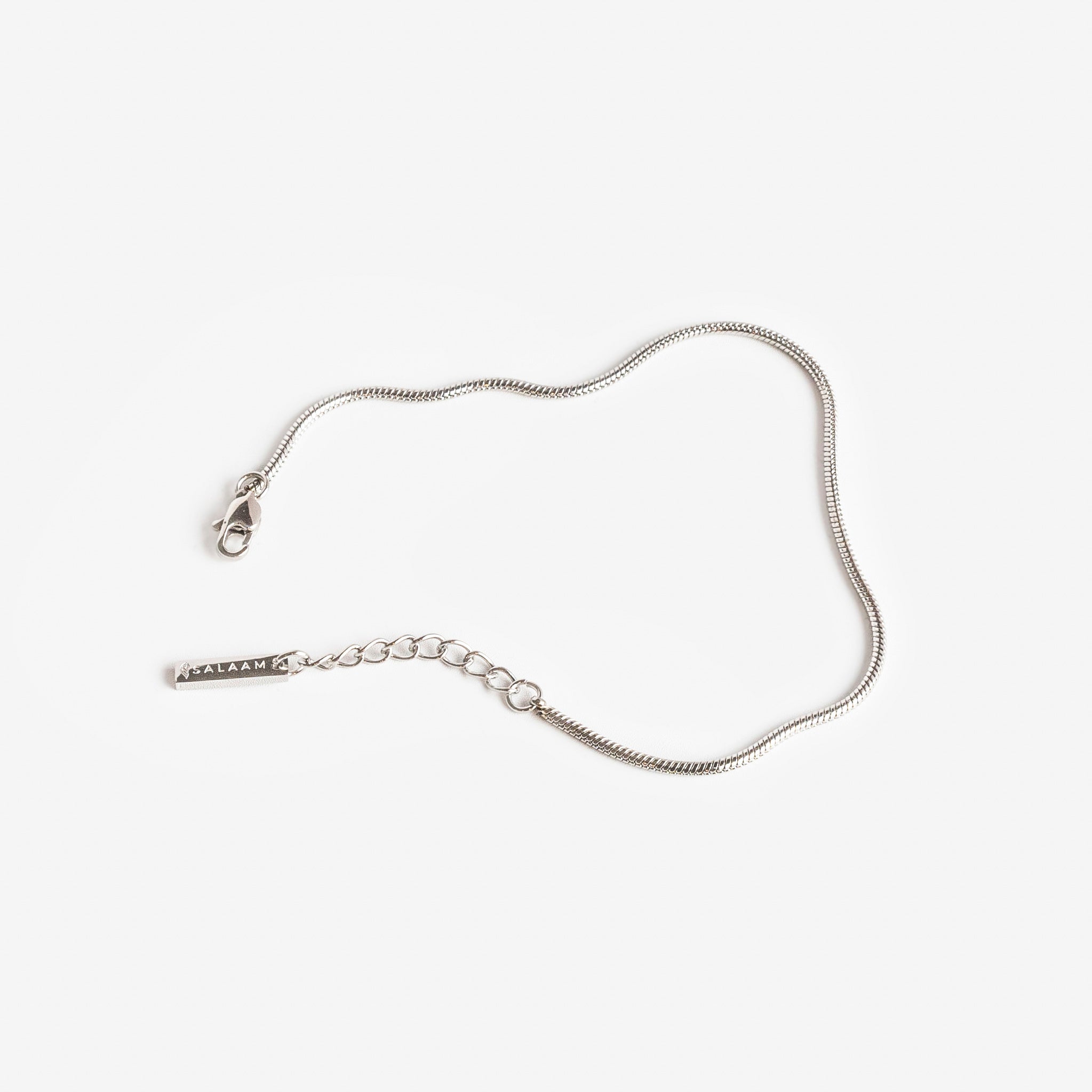 silver stainless steel minimal snake chain bracelet by Salaam Gallery, elegant and affordable jewelry		