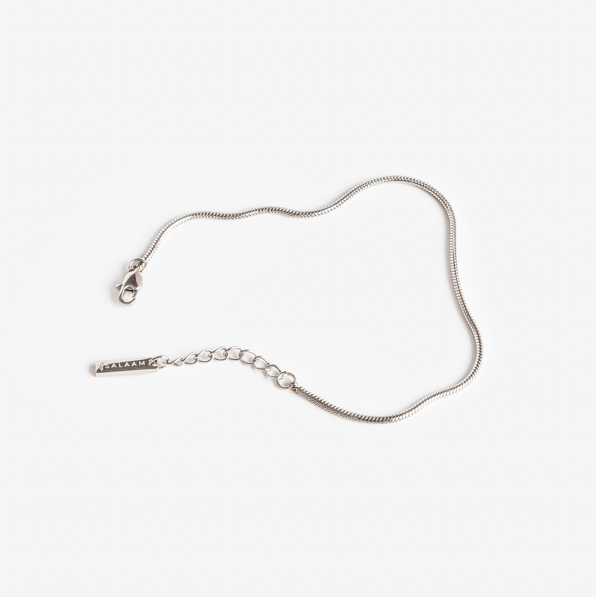 silver stainless steel minimal snake chain bracelet by Salaam Gallery, elegant and affordable jewelry		