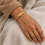 Thurayya Cluster Bangle – 18K gold plated stainless steel, styled lifestyle shot