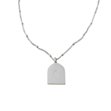 Back view of silver Ud‘ooni Necklace with minimalist arch-shaped pendant and engraved logo, photographed on a white background.